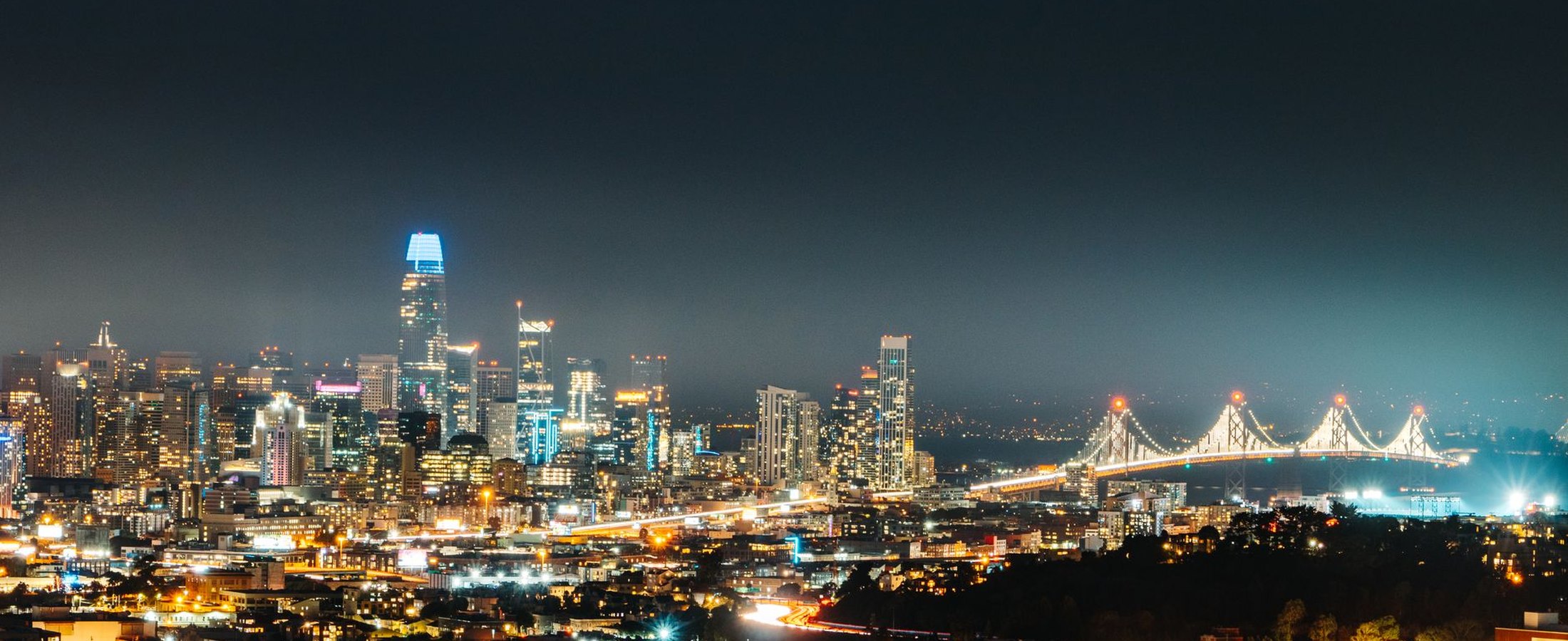 The San Francisco skyline and the Bay Bridge at night